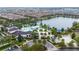 Resort-style community pool, clubhouse and a sandy volleyball court in a tropical setting near the lake at 2186 Fleming Mist Pl, Kissimmee, FL 34747