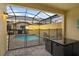 Private pool with screened enclosure, brick patio and lounging area at 2186 Fleming Mist Pl, Kissimmee, FL 34747