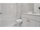 Bathroom with white vanity, shower/tub combo, and tile floor at 2230 Standing Rock Cir, Oakland, FL 34787