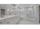 Elegant bathroom with double vanity, soaking tub, and glass shower at 2230 Standing Rock Cir, Oakland, FL 34787