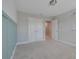 Bedroom with gray carpet, double doors, and a whimsical wall decal at 2230 Standing Rock Cir, Oakland, FL 34787