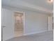 Bedroom with gray carpet and access to bathroom at 2230 Standing Rock Cir, Oakland, FL 34787