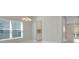 Dining room with large window, chandelier, and built-in hutch at 2230 Standing Rock Cir, Oakland, FL 34787