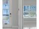 Bright entryway with glass front door and view into the house at 2230 Standing Rock Cir, Oakland, FL 34787