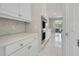 White kitchen cabinets and hexagon backsplash at 2230 Standing Rock Cir, Oakland, FL 34787