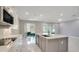 Open concept kitchen with island and view to backyard at 2230 Standing Rock Cir, Oakland, FL 34787