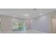 Living room with sliding doors and light walls at 2230 Standing Rock Cir, Oakland, FL 34787