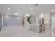 Open living area with kitchen island and stairs at 2230 Standing Rock Cir, Oakland, FL 34787