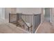 Modern staircase with gray railings and carpeted steps at 2230 Standing Rock Cir, Oakland, FL 34787