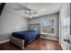 Bedroom with light grey walls, a ceiling fan, and a single window at 2417 Liela Lee Ct, Ocoee, FL 34761