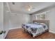 Bedroom with neutral walls, a ceiling fan, and a window with white shutters at 2417 Liela Lee Ct, Ocoee, FL 34761