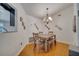 Elegant dining room featuring a stylish chandelier and wood floors at 2417 Liela Lee Ct, Ocoee, FL 34761