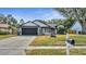 Charming single-story home featuring a well-maintained lawn, two-car garage, and neutral paint scheme at 2417 Liela Lee Ct, Ocoee, FL 34761