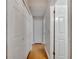 Hallway features wood floors, white doors, and neutral walls at 2417 Liela Lee Ct, Ocoee, FL 34761