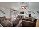 Spacious living room featuring hardwood floors, comfortable seating, and a view of the outdoor space at 2417 Liela Lee Ct, Ocoee, FL 34761