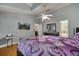 Cozy main bedroom with vaulted ceiling, ceiling fan, and wood floors at 2417 Liela Lee Ct, Ocoee, FL 34761