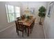 Bright dining room with wood table and six chairs at 2509 La Jolla Trl, Kissimmee, FL 34747