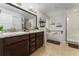 Modern bathroom with double vanity and a soaking tub at 264 Citrus Pointe Dr, Haines City, FL 33844
