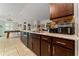 Kitchen features an island with breakfast bar and stainless steel appliances at 264 Citrus Pointe Dr, Haines City, FL 33844