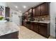 Spacious kitchen with dark wood cabinets and granite countertops at 264 Citrus Pointe Dr, Haines City, FL 33844