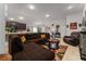 Living room with brown sectional sofa and a fireplace at 264 Citrus Pointe Dr, Haines City, FL 33844