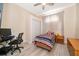 Cozy bedroom with a twin bed, desk, and window at 2715 Rismen Ct, Kissimmee, FL 34743