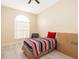 Small bedroom with twin bed and an arched window at 2715 Rismen Ct, Kissimmee, FL 34743
