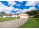 House with a large yard and driveway at 2715 Rismen Ct, Kissimmee, FL 34743