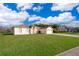 Two-story house with a large yard and driveway at 2715 Rismen Ct, Kissimmee, FL 34743