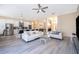 Open concept living room and kitchen with white sofas at 2715 Rismen Ct, Kissimmee, FL 34743