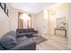 Living room with gray sectional sofa and hardwood floors at 2715 Rismen Ct, Kissimmee, FL 34743