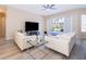 Living room with white sofas and sliding glass doors at 2715 Rismen Ct, Kissimmee, FL 34743