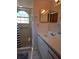 Bathroom featuring tiled shower, single vanity, and a large window at 2741 N Poinciana Blvd # 43, Kissimmee, FL 34746