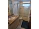 This bathroom features a shower-tub combination and a granite-topped sink at 2741 N Poinciana Blvd # 43, Kissimmee, FL 34746
