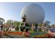 A view of Epcot's geodetic sphere with flower displays in the foreground at 2741 N Poinciana Blvd # 43, Kissimmee, FL 34746