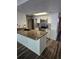Open kitchen with granite island, stainless steel appliances, and white cabinetry at 2741 N Poinciana Blvd # 43, Kissimmee, FL 34746