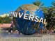 A view of Universal Studios' globe in front of a crowd at 2741 N Poinciana Blvd # 43, Kissimmee, FL 34746