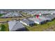 Wide aerial view of a neighborhood showcasing the roofs of many single-Gathering homes at 306 Hang Loose Way, Daytona Beach, FL 32124