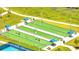 An aerial view of bocce ball courts shaded by canopies and benches at 306 Hang Loose Way, Daytona Beach, FL 32124