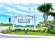 Entrance sign of Latitude Margaritaville with vibrant landscaping and welcoming atmosphere at 306 Hang Loose Way, Daytona Beach, FL 32124