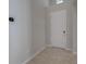 Inviting foyer featuring neutral paint, tiled floor, and a convenient smart thermostat at 306 Hang Loose Way, Daytona Beach, FL 32124