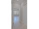 Hallway view into a bedroom featuring tile flooring and plenty of natural light at 306 Hang Loose Way, Daytona Beach, FL 32124