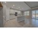 Spacious kitchen boasts a large island, white cabinets, and stainless-steel appliances at 306 Hang Loose Way, Daytona Beach, FL 32124