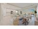 Bright and airy living room featuring tile floors and sliding glass doors to the backyard at 306 Hang Loose Way, Daytona Beach, FL 32124