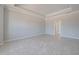 Neutral living room features tray ceiling, tile flooring and lots of natural light at 306 Hang Loose Way, Daytona Beach, FL 32124