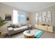 Stylish living room with comfortable seating, gallery wall, and bright, airy ambiance at 306 Hang Loose Way, Daytona Beach, FL 32124