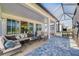 Inviting covered patio with comfortable seating and outdoor dining area for relaxing at 306 Hang Loose Way, Daytona Beach, FL 32124