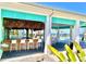 Open-air poolside bar with modern stools and a bamboo-style facade, perfect for enjoying tropical drinks at 306 Hang Loose Way, Daytona Beach, FL 32124