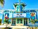 Exterior of the Last Mango Theater in Latitude Margaritaville, decorated with palm trees and tropical colors at 306 Hang Loose Way, Daytona Beach, FL 32124
