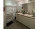 Clean bathroom with double sinks and a walk-in shower at 3181 Serendipity Way, Davenport, FL 33896